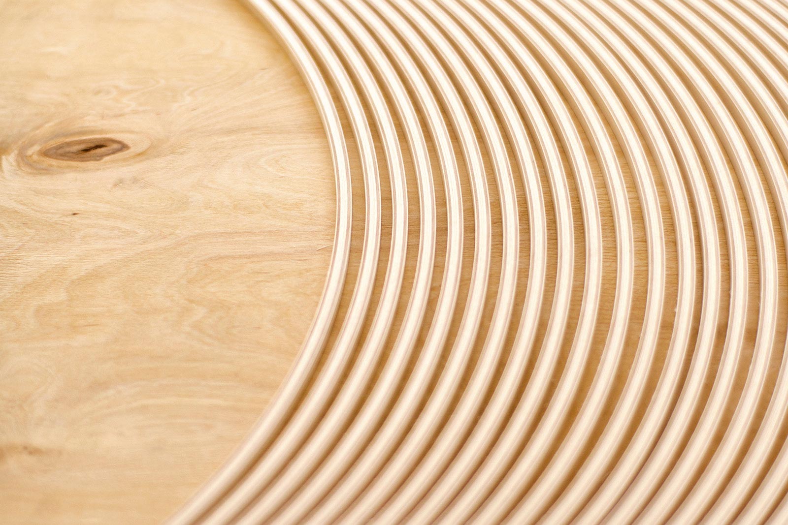 A close up of the curved wooden slats used in Secto Design lamps.