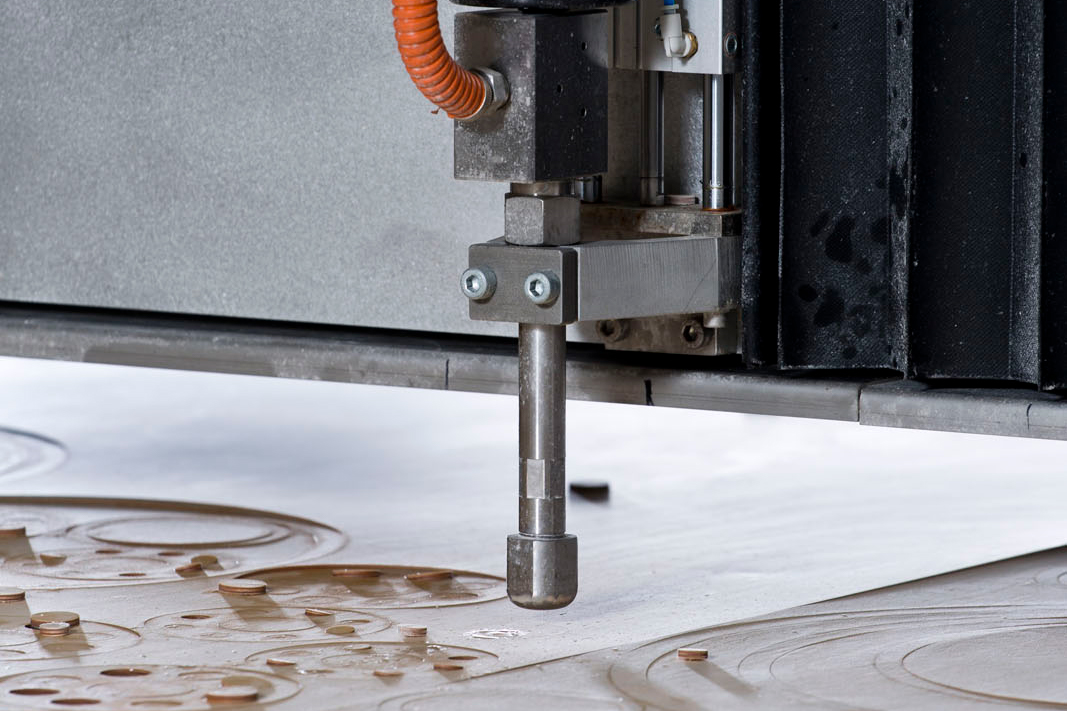 A close-up of the waterjet’s cutting head.