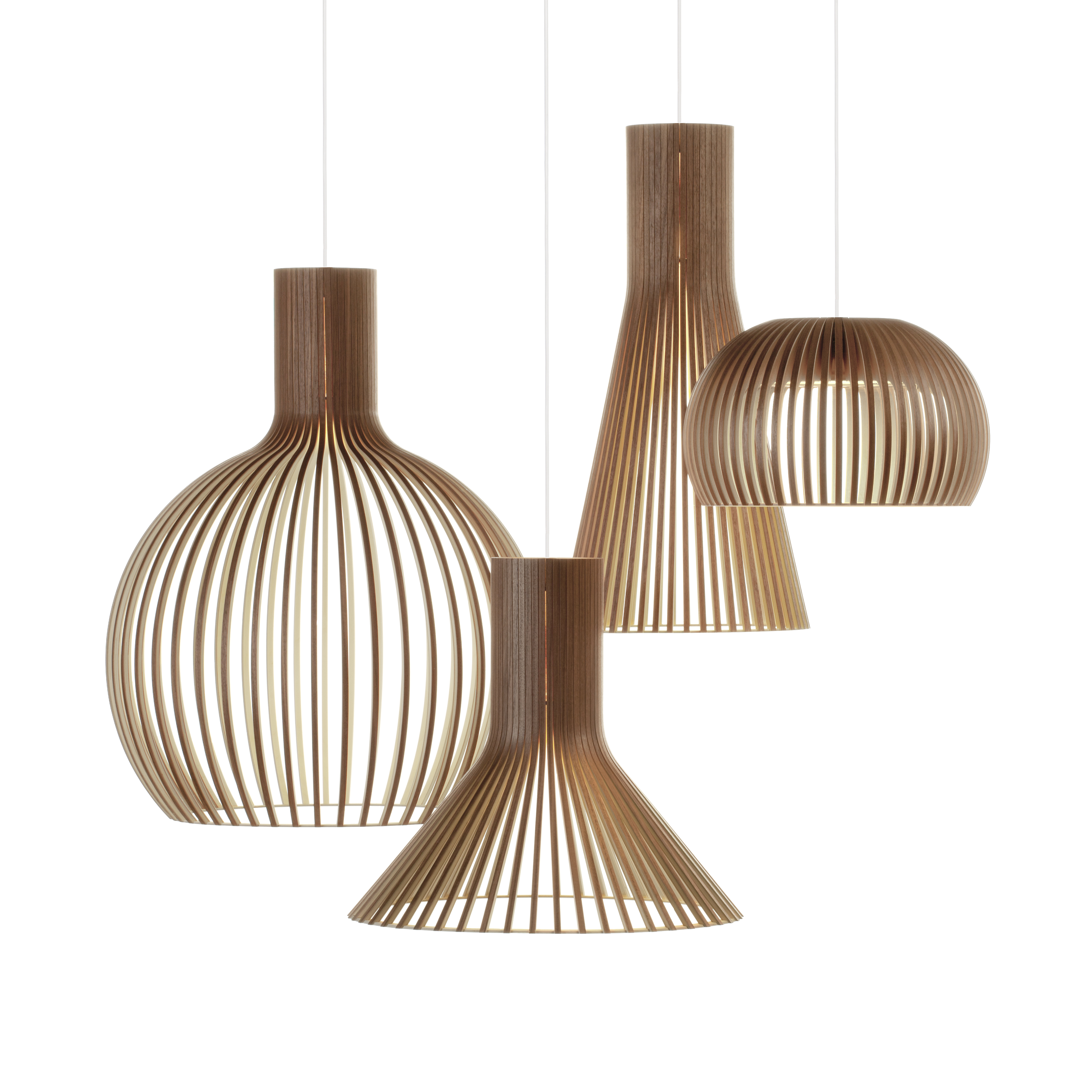 A group of walnut veneered Octo, Puncto, Secto and Atto pendant lamps.