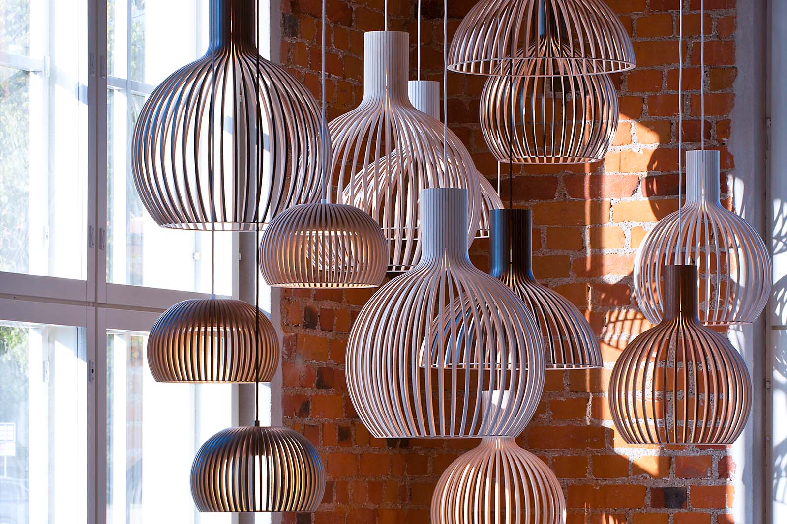 A collection of Octo-, Victo- and Atto pendant lamps in various colors and finishes.